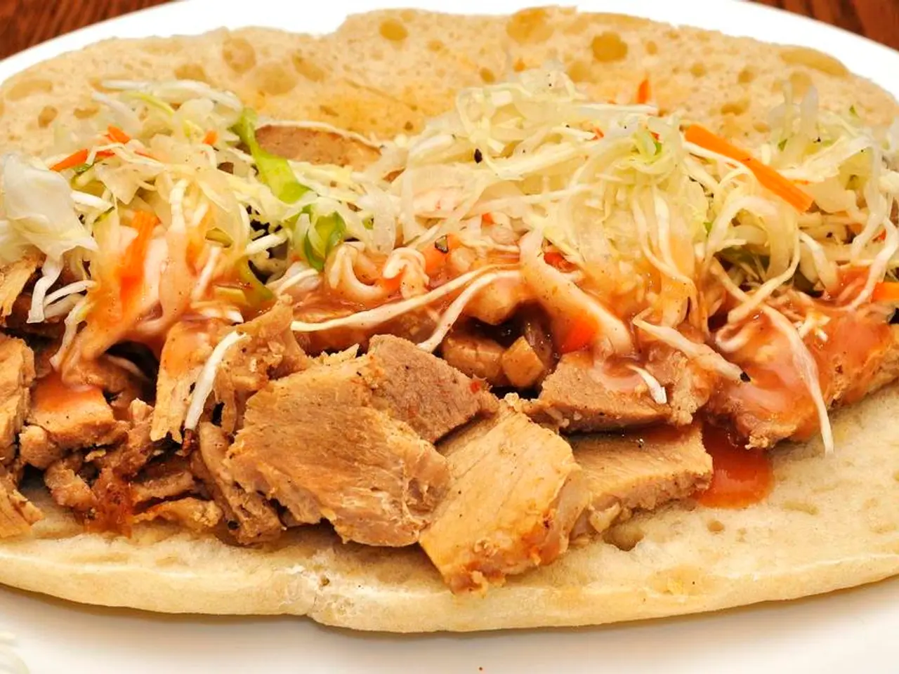 Rivista Sandwichteria Italiana nel Lower East Side, chiamata La Bottega di Regina, che riporta...